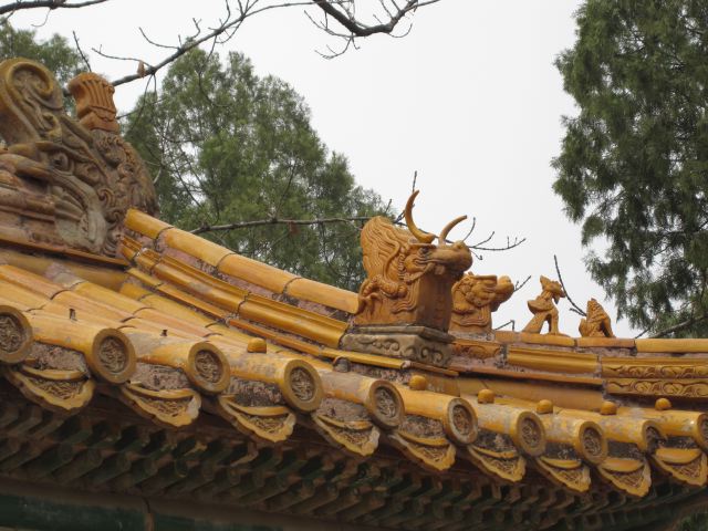 Roof with mythical characters in terra cotta tiles